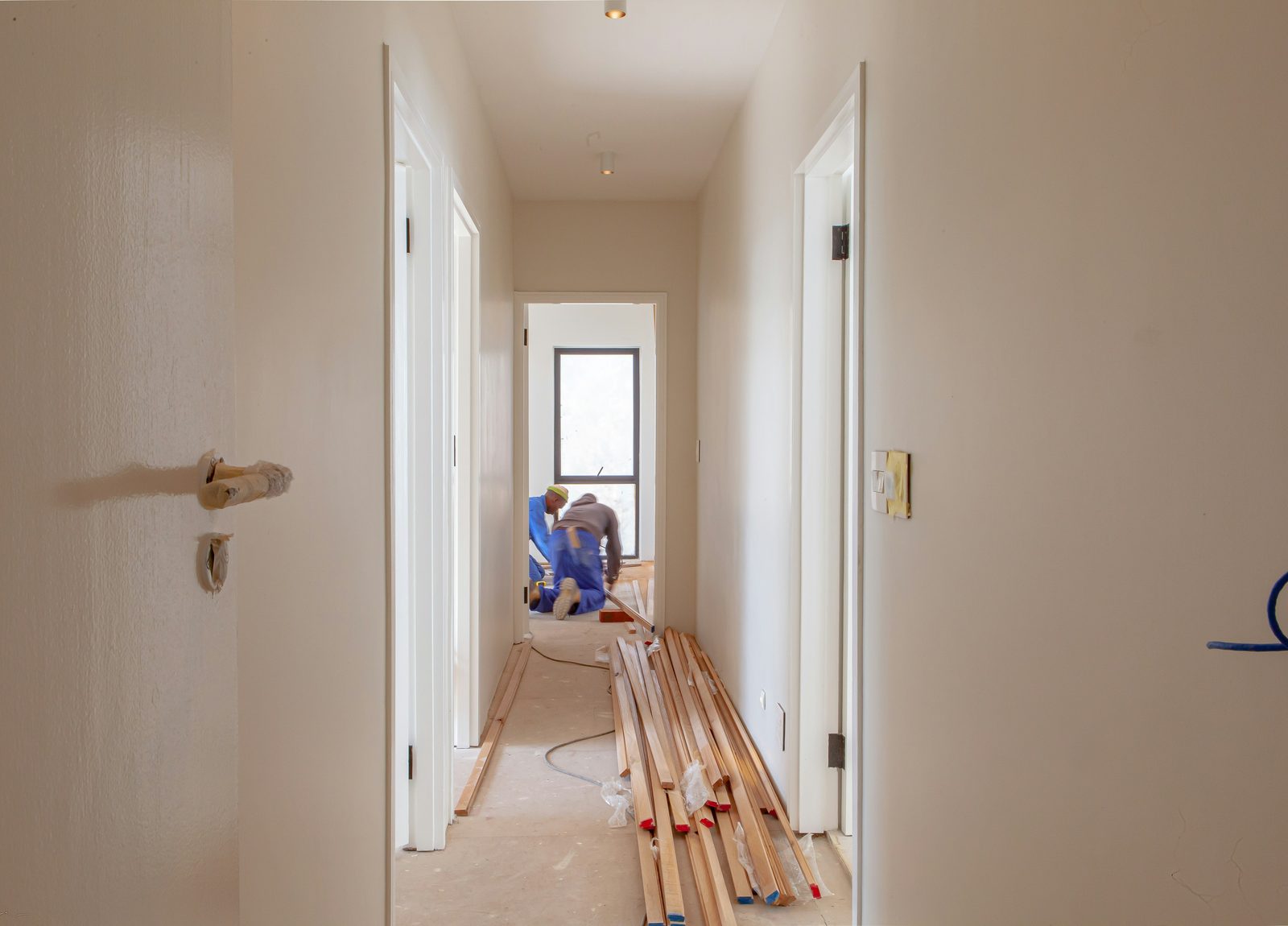 A Kohan R&R crew member at work inside a home mid-renovation