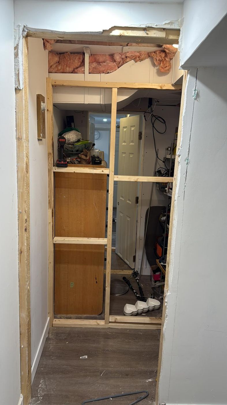Wall framing opened up to add a new powder room