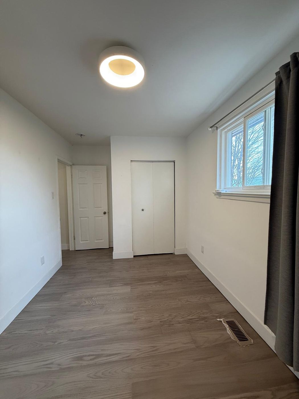 Freshly painted bedroom with new ceiling light